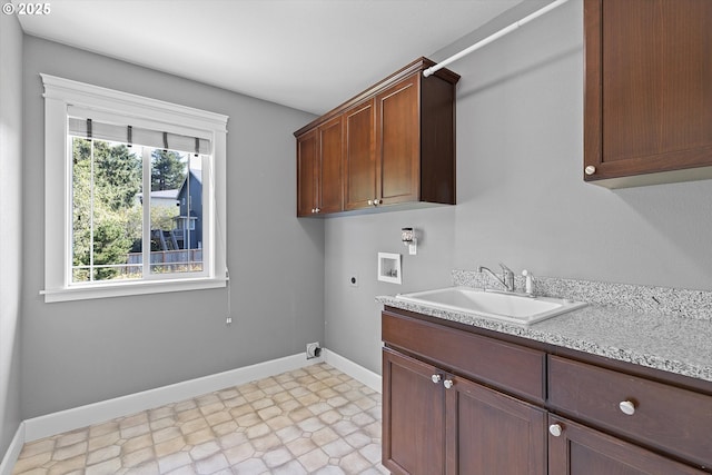 washroom featuring washer hookup, electric dryer hookup, cabinets, and sink