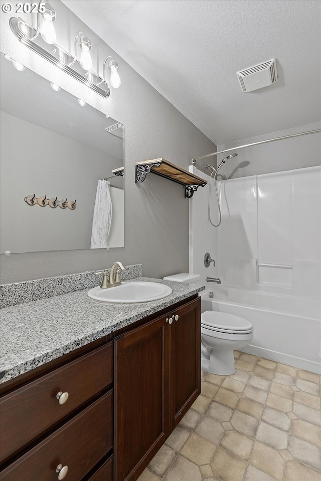 full bathroom featuring shower / bathing tub combination, vanity, and toilet