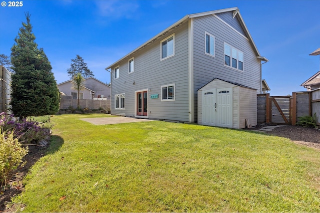 rear view of property featuring a storage shed, a patio area, and a lawn