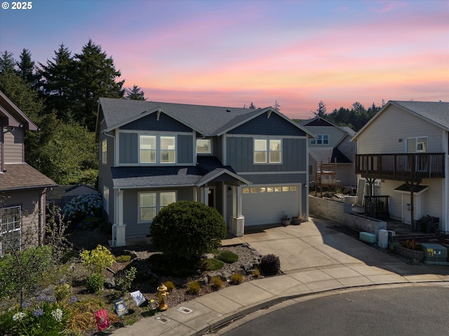 7115 NE Benton Pl, Newport, OR 97365 - view of front of house featuring an attached garage, concrete driveway, board and batten siding, and a shingled roof