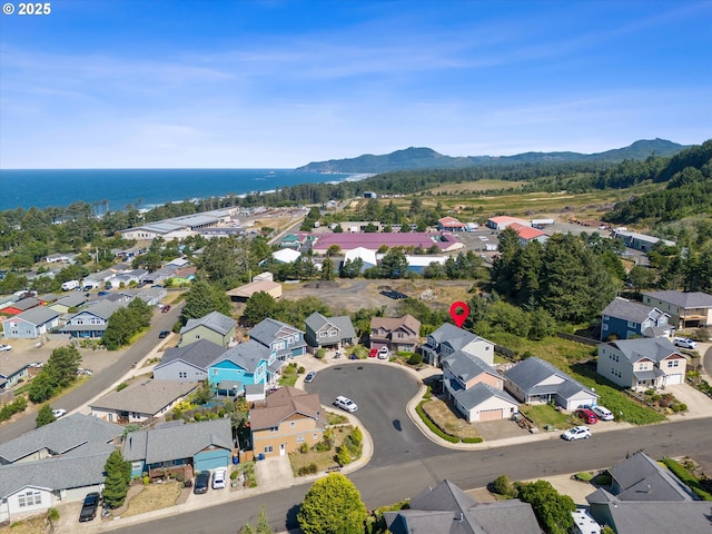 7115 NE Benton Pl, Newport, OR 97365 - aerial perspective of suburban area with a water and mountain view