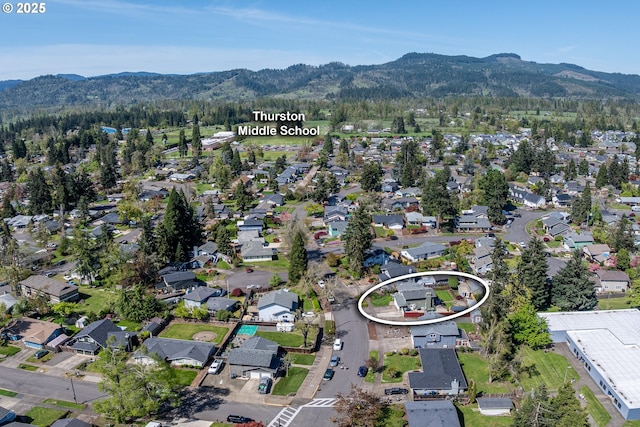 bird's eye view with a residential view and a mountain view