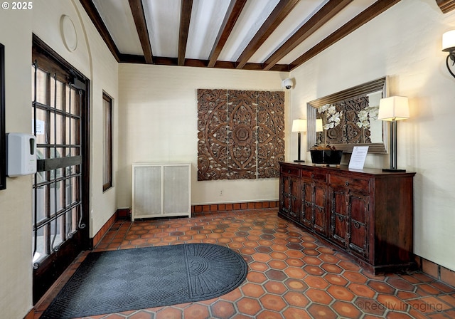 709 SW 16th Ave Unit 105, Portland, OR 97205 - entrance foyer with beamed ceiling and tile patterned flooring