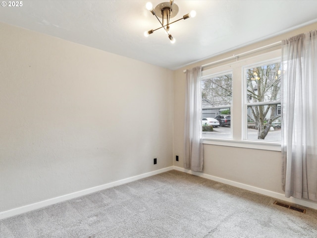 8978 SW Terreton Pl, Portland, OR 97223 - empty room featuring a chandelier, carpet floors, and baseboards