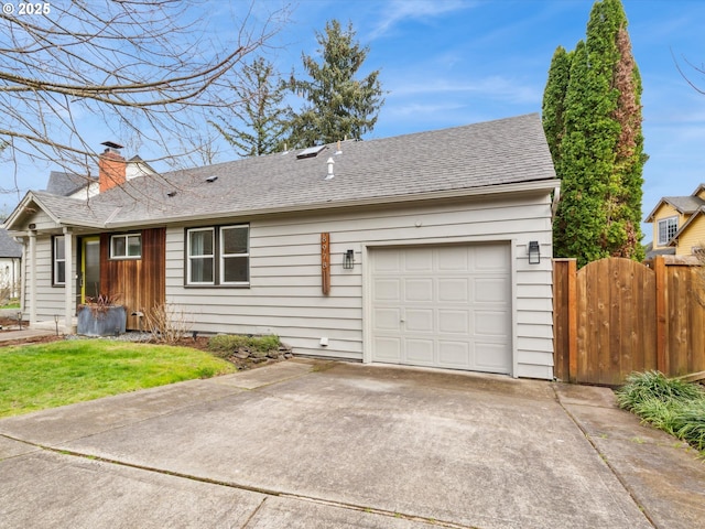 8978 SW Terreton Pl, Portland, OR 97223 - view of front facade featuring driveway, an attached garage, a chimney, and roof with shingles