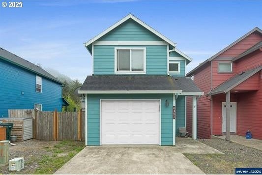8465 S Hollyhock St, Rockaway Beach, OR 97136 - traditional-style house with roof with shingles, driveway, fence, and an attached garage