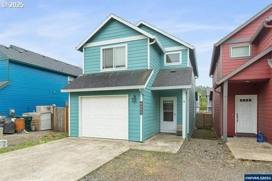 8465 S Hollyhock St, Rockaway Beach, OR 97136 - view of front facade with an attached garage, fence, a shingled roof, and driveway