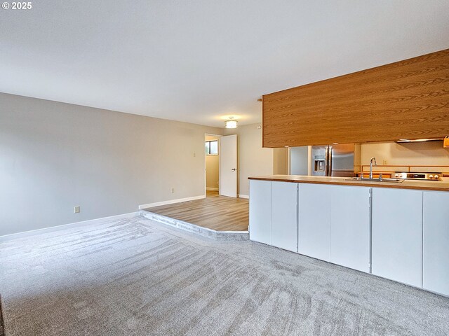 unfurnished living room with carpet floors