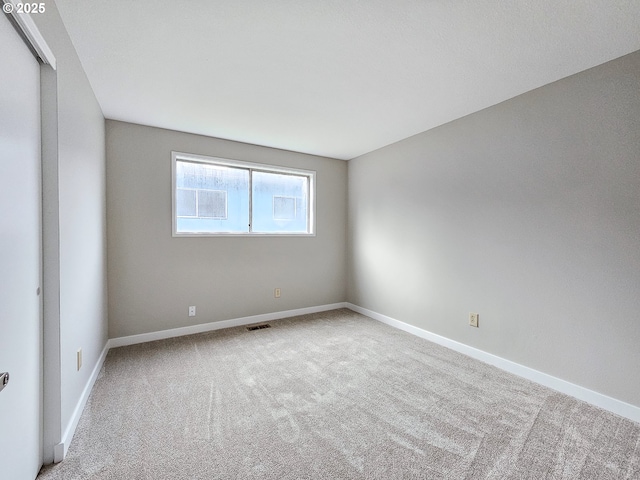 empty room featuring carpet flooring