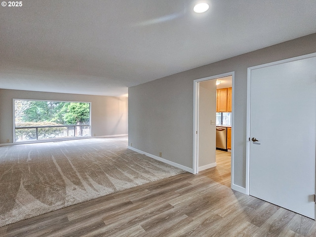 unfurnished room featuring light hardwood / wood-style floors