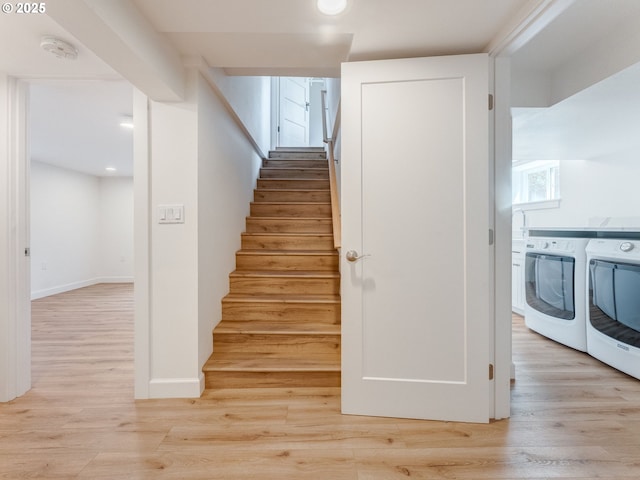 staircase with washer and dryer, wood finished floors, recessed lighting, and baseboards