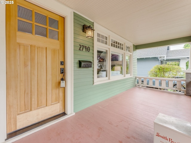 doorway to property with a porch