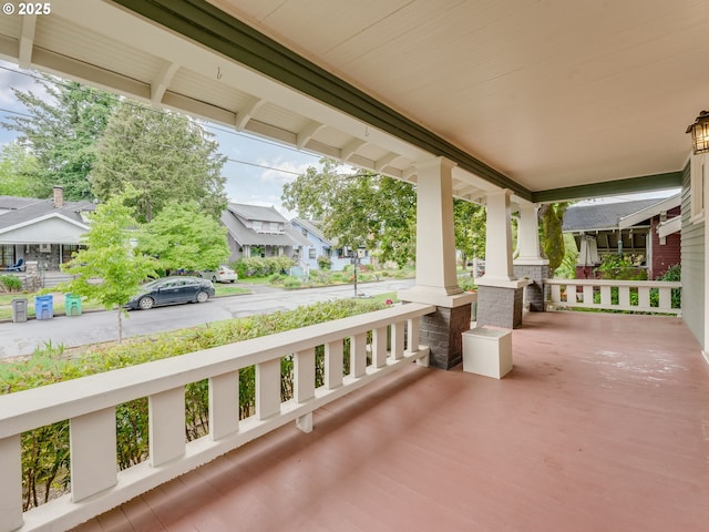 view of patio / terrace featuring covered porch and a residential view