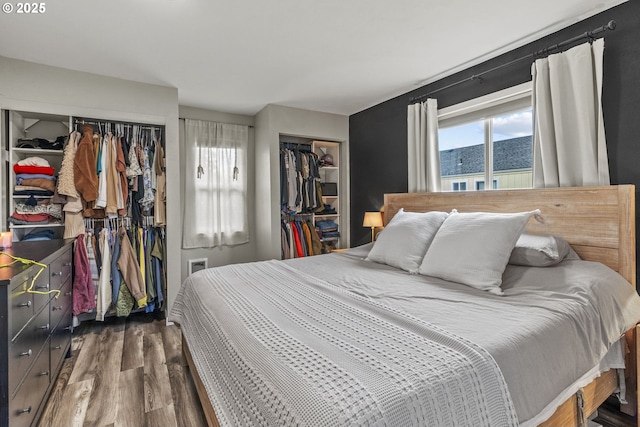 bedroom featuring dark wood-type flooring