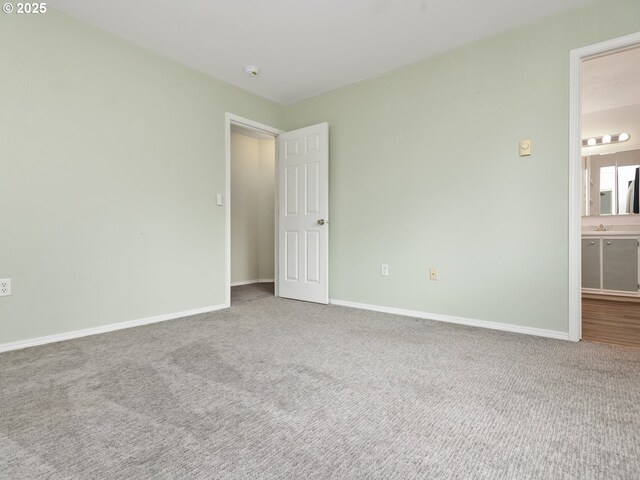 7143 SW Sagert St Unit 105, Tualatin, OR 97062 - unfurnished bedroom with carpet floors and ensuite bath