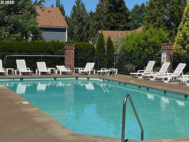 7143 SW Sagert St Unit 105, Tualatin, OR 97062 - community pool featuring a patio area and view of scattered trees