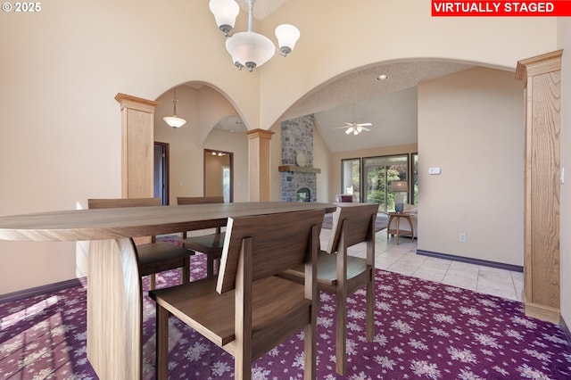 16402 SE Teal Ct, Damascus, OR 97089 - dining space featuring arched walkways, ornate columns, ceiling fan, baseboards, and light tile patterned floors