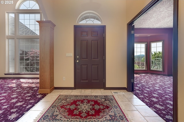 16402 SE Teal Ct, Damascus, OR 97089 - foyer with light carpet, baseboards, and a towering ceiling
