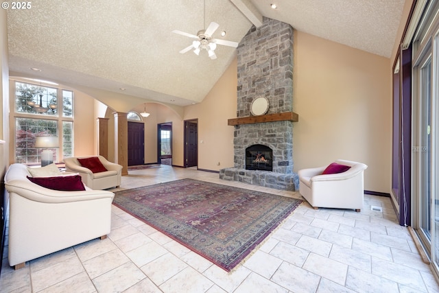 16402 SE Teal Ct, Damascus, OR 97089 - living area featuring ornate columns, healthy amount of natural light, ceiling fan, beam ceiling, and high vaulted ceiling