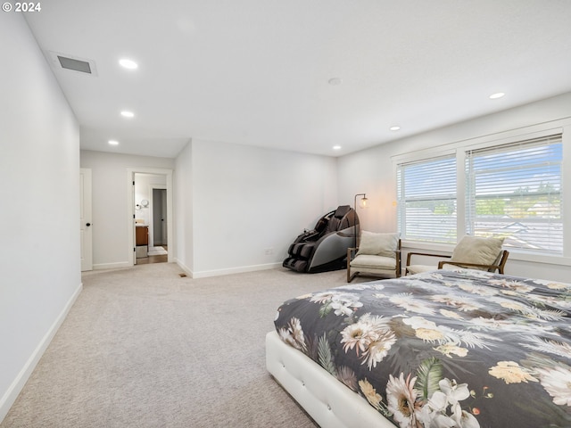 bedroom with light colored carpet