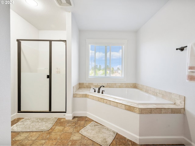 bathroom featuring a shower with shower door