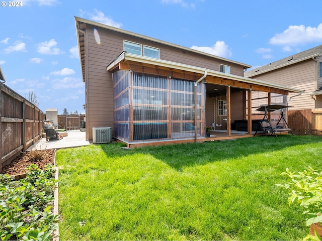 back of house with a yard, central AC, and a patio