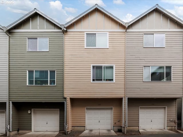 17473 SW October Ct, Beaverton, OR 97003 - view of front of house with a garage and board and batten siding