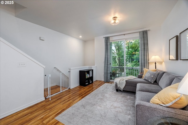 17473 SW October Ct, Beaverton, OR 97003 - living room with wood finished floors, baseboards, and recessed lighting