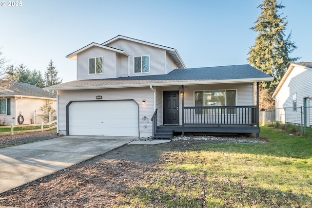 view of front of property featuring a garage, a front lawn, and a porch