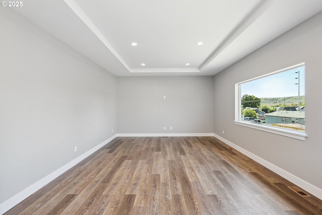 365 NW 4th St, Dufur, OR 97021 - spare room featuring recessed lighting, a raised ceiling, wood finished floors, and baseboards