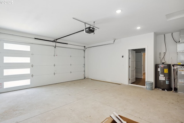 365 NW 4th St, Dufur, OR 97021 - garage with water heater, a garage door opener, and recessed lighting