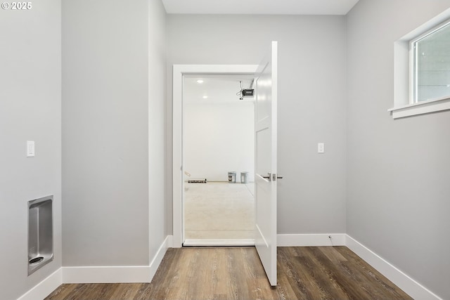 365 NW 4th St, Dufur, OR 97021 - clothes washing area with wood finished floors and baseboards