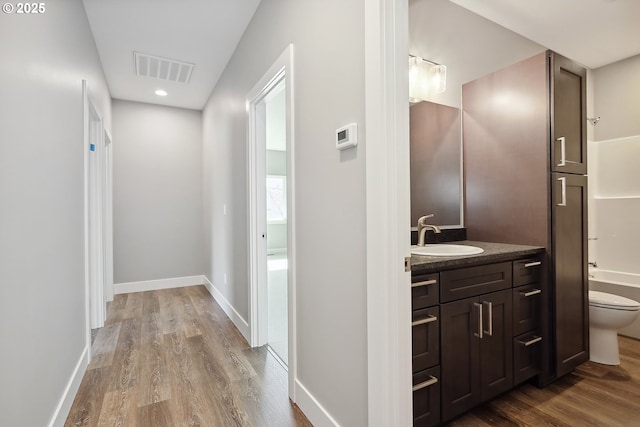365 NW 4th St, Dufur, OR 97021 - hall with a sink, wood finished floors, baseboards, and recessed lighting