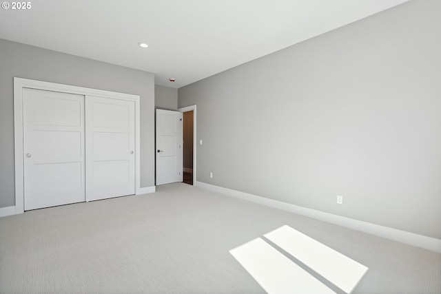 365 NW 4th St, Dufur, OR 97021 - unfurnished bedroom featuring light carpet, a closet, baseboards, and recessed lighting