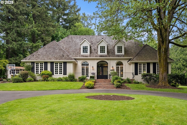 21424 SW 65th Ave, Tualatin, OR 97062 - cape cod house with french doors, driveway, and a front yard