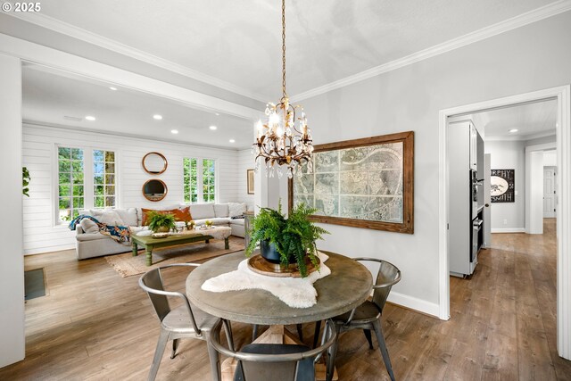 21424 SW 65th Ave, Tualatin, OR 97062 - dining space featuring recessed lighting, hardwood / wood-style floors, baseboards, crown molding, and a chandelier