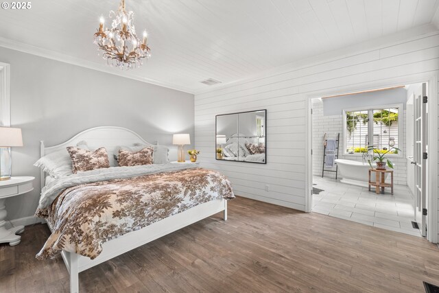 21424 SW 65th Ave, Tualatin, OR 97062 - bedroom featuring wooden walls, wood finished floors, a chandelier, ornamental molding, and connected bathroom