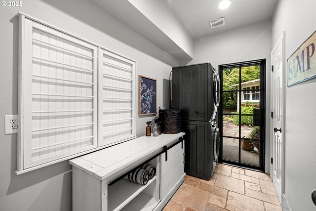 21424 SW 65th Ave, Tualatin, OR 97062 - mudroom with stacked washer / dryer, stone tile floors, and recessed lighting