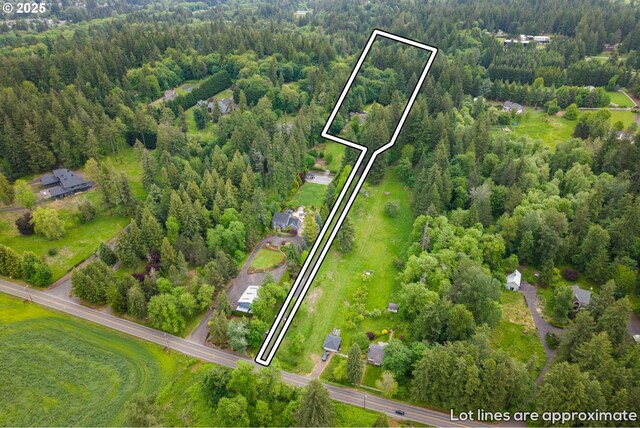 21424 SW 65th Ave, Tualatin, OR 97062 - aerial view of property and surrounding area featuring a heavily wooded area and property boundaries highlighted