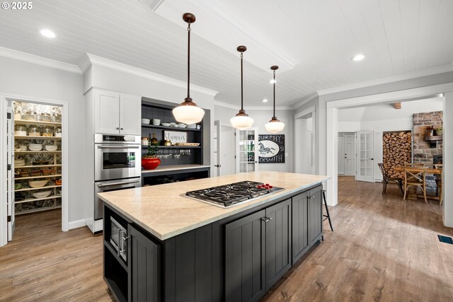 21424 SW 65th Ave, Tualatin, OR 97062 - kitchen featuring appliances with stainless steel finishes, open shelves, white cabinetry, a kitchen island, and light wood-style floors
