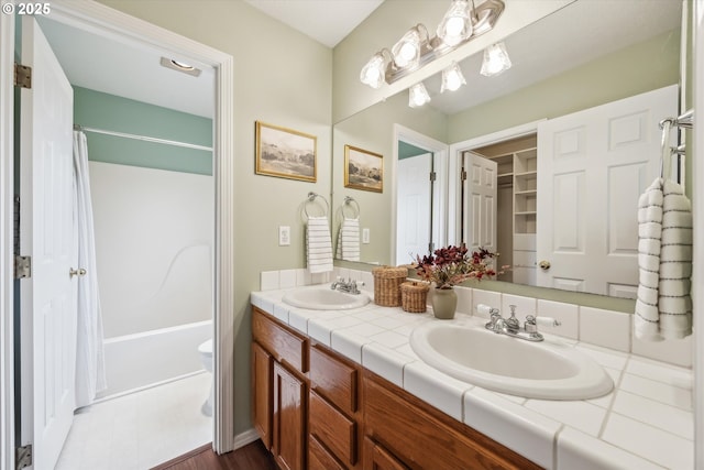 bathroom featuring a sink, double vanity, and shower / bath combination with curtain