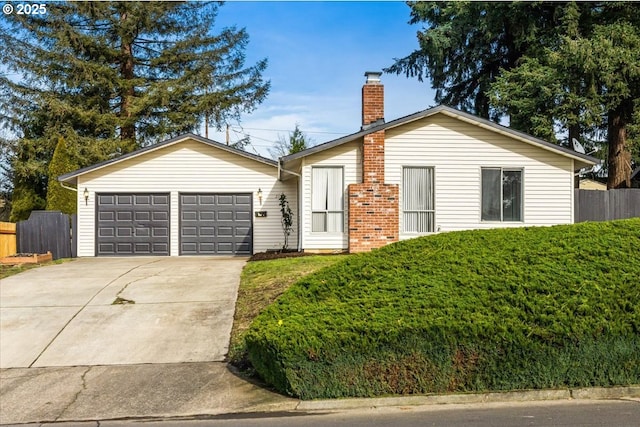 ranch-style house featuring a garage and a front yard