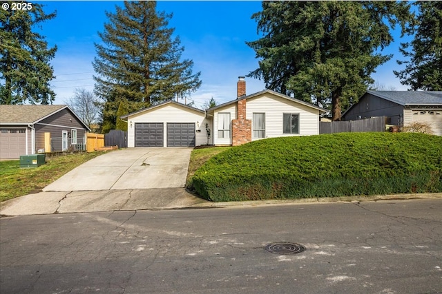 ranch-style house featuring a garage