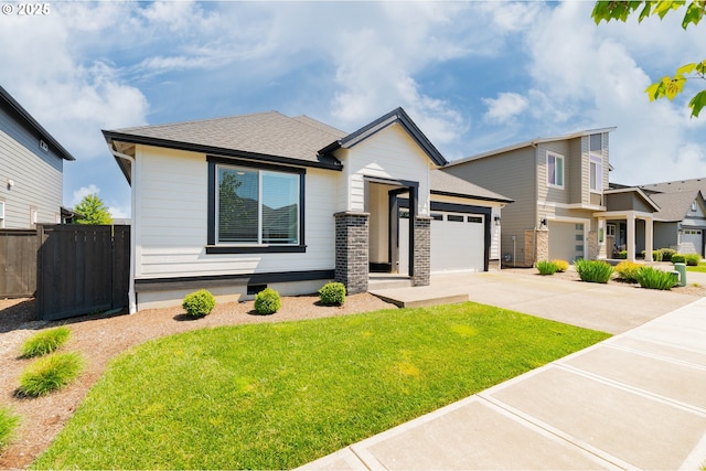 10107 NE 136th Ave, Vancouver, WA 98682 - view of front of home with concrete driveway, an attached garage, and a shingled roof