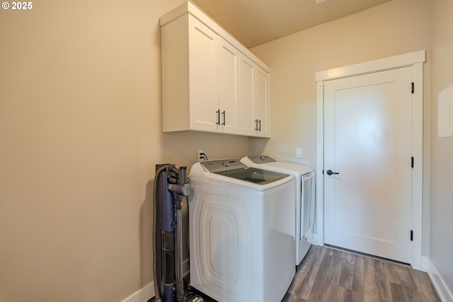 10107 NE 136th Ave, Vancouver, WA 98682 - washroom with washing machine and dryer, cabinet space, wood finished floors, and baseboards