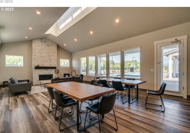 10107 NE 136th Ave, Vancouver, WA 98682 - dining area with a brick fireplace, lofted ceiling, plenty of natural light, dark wood-style flooring, and recessed lighting