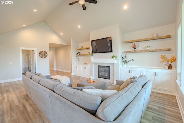 10107 NE 136th Ave, Vancouver, WA 98682 - living room featuring a ceiling fan, high vaulted ceiling, a glass covered fireplace, light wood finished floors, and recessed lighting