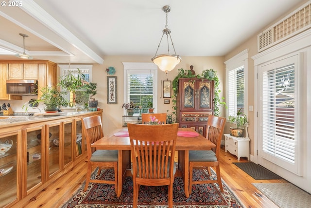 dining area with light wood-style floors