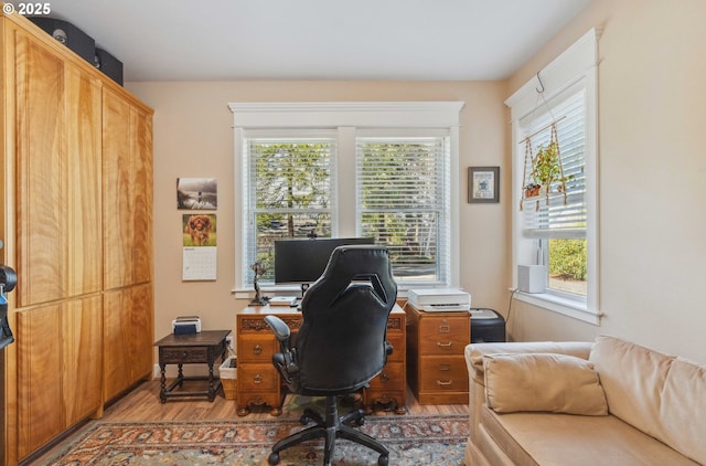 office space featuring light wood-style floors