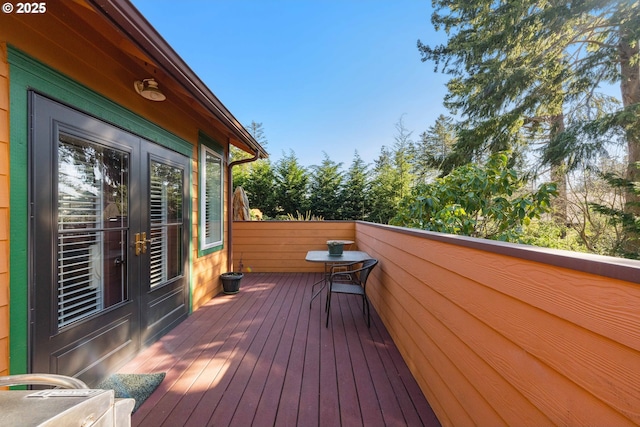 wooden deck featuring french doors